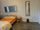Bright bedroom with a large bed, bedside tables, and neutral decor at 2602 W Berridge Ln # C102, Phoenix, AZ 85017
