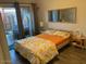 Well-lit bedroom featuring stylish bedding and a view to the outdoors at 2602 W Berridge Ln # C102, Phoenix, AZ 85017