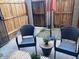 Cozy outdoor space with contemporary furniture, privacy fence, and direct access to the home at 2602 W Berridge Ln # C102, Phoenix, AZ 85017