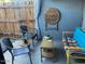 Patio area with charming outdoor decor, wooden privacy fence, and ample seating at 2602 W Berridge Ln # C102, Phoenix, AZ 85017