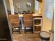 Eat-in kitchen featuring two chairs and a view of the backyard at 2602 W Berridge Ln # C102, Phoenix, AZ 85017