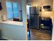 Charming kitchen showcasing modern appliances and breakfast bar, offering a blend of style and functionality at 2602 W Berridge Ln # C102, Phoenix, AZ 85017