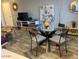 Cozy living room and dining area with modern furniture, neutral tones, and an inviting atmosphere at 2602 W Berridge Ln # C102, Phoenix, AZ 85017