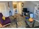 Comfortable living space featuring a sofa, wooden table, guitar, and artistic decor, creating a cozy and stylish ambiance at 2602 W Berridge Ln # C102, Phoenix, AZ 85017