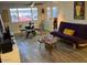 Bright living room featuring large windows, modern furniture, and stylish decor, with an open and inviting atmosphere at 2602 W Berridge Ln # C102, Phoenix, AZ 85017