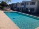 Sparkling community pool with plenty of space for lounging and a dining space nearby at 2602 W Berridge Ln # C102, Phoenix, AZ 85017