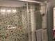 Shower stall featuring mosaic tile and a rain shower head at 2602 W Berridge Ln # C102, Phoenix, AZ 85017