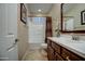 Cozy bathroom features a white vanity countertop, wood cabinets, tiled floor, and combination tub and shower at 269 E Horseshoe Dr, Chandler, AZ 85249