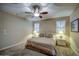 Well-lit bedroom features plush carpeting, neutral walls, and matching nightstands for ultimate comfort at 269 E Horseshoe Dr, Chandler, AZ 85249