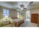 Serene bedroom featuring neutral tones, large windows, and a connecting bathroom with a glass-enclosed shower at 269 E Horseshoe Dr, Chandler, AZ 85249