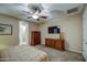 Spacious bedroom boasts matching wood dressers, ceiling fan, and plush carpeting for ultimate comfort at 269 E Horseshoe Dr, Chandler, AZ 85249