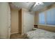 Serene bedroom with a ceiling fan, shuttered windows and closet at 269 E Horseshoe Dr, Chandler, AZ 85249