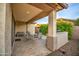 Charming covered patio offering outdoor seating, a built-in grill, and privacy landscaping at 269 E Horseshoe Dr, Chandler, AZ 85249