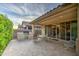 Covered outdoor patio with built-in BBQ area, tile flooring, and access to the home's interior at 269 E Horseshoe Dr, Chandler, AZ 85249
