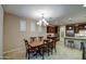 Traditional dining room with chandelier, plantation shutters, and easy access to the kitchen at 269 E Horseshoe Dr, Chandler, AZ 85249