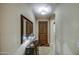 Welcoming entryway with tiled floors, warm lighting, and a beautiful wood door at 269 E Horseshoe Dr, Chandler, AZ 85249