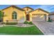Home featuring desert landscaping, neutral stucco, decorative tile roof, two car garage and paver driveway at 269 E Horseshoe Dr, Chandler, AZ 85249
