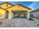 View of the two car garage with door open showing water softener and heater, concrete flooring and lighting at 269 E Horseshoe Dr, Chandler, AZ 85249