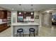 Modern kitchen island with seating, pendant lighting, and stainless steel appliances at 269 E Horseshoe Dr, Chandler, AZ 85249