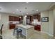Spacious kitchen with dark wood cabinetry, a large island, and ample lighting fixtures at 269 E Horseshoe Dr, Chandler, AZ 85249