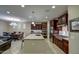 Gourmet kitchen with a central island, stainless steel appliances, and a dining area nearby at 269 E Horseshoe Dr, Chandler, AZ 85249