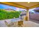 Outdoor patio with tile flooring, seating, outdoor kitchen, and built-in grill at 269 E Horseshoe Dr, Chandler, AZ 85249