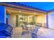 Covered outdoor patio with tile flooring, dining seating, and view to the interior at 269 E Horseshoe Dr, Chandler, AZ 85249