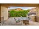 Outdoor patio with dining area, built in bbq, lush landscaping and covered seating at 269 E Horseshoe Dr, Chandler, AZ 85249