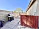 Private backyard patio area with a stainless steel grill and stone pathway to the main back yard area at 2735 E Harwell Rd, Gilbert, AZ 85234