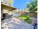 Backyard featuring a well-maintained lawn, patio, covered outdoor seating and a sparkling pool for summer enjoyment at 2735 E Harwell Rd, Gilbert, AZ 85234