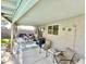 Covered patio includes a table with four chairs, as well as two additional chairs at 2735 E Harwell Rd, Gilbert, AZ 85234