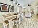 Cozy dining area connected to the living room, featuring a farmhouse-style table and chairs at 2735 E Harwell Rd, Gilbert, AZ 85234