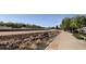 A neighborhood drainage canal and adjacent path in Tone Estates, offering natural scenery and flood control at 2735 E Harwell Rd, Gilbert, AZ 85234