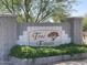 A classic stone entry sign for Tone Estates surrounded by manicured greenery, creating a welcoming atmosphere at 2735 E Harwell Rd, Gilbert, AZ 85234