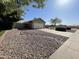 Charming single-story home with a two-car garage and desert-style landscaping at 2735 E Harwell Rd, Gilbert, AZ 85234