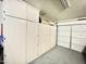 Garage with a large wall of storage cabinets at 2735 E Harwell Rd, Gilbert, AZ 85234