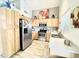 Well-equipped kitchen with stainless steel appliances, ample storage, and wood-look flooring at 2735 E Harwell Rd, Gilbert, AZ 85234