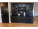 Charming built-in bar featuring glass cabinets and a wine rack at 288 E Baylor Ln, Gilbert, AZ 85296