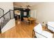Bright dining area with wood table, chairs, and access to the staircase at 288 E Baylor Ln, Gilbert, AZ 85296