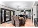 Open concept dining area with elegant seating and a view into the modern kitchen at 288 E Baylor Ln, Gilbert, AZ 85296