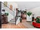 Inviting entryway with staircase, decorative elements, and hardwood floors at 288 E Baylor Ln, Gilbert, AZ 85296