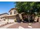 Beautiful home with mature tree and well-maintained desert landscaping in the front yard at 288 E Baylor Ln, Gilbert, AZ 85296