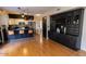Open concept kitchen with stainless appliances, breakfast bar and custom cabinetry at 288 E Baylor Ln, Gilbert, AZ 85296