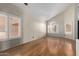 Bright living room features wood floors, large windows with bright light and high ceilings at 288 E Baylor Ln, Gilbert, AZ 85296