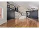 Spacious living room showcasing soaring ceilings, a staircase and wooden floors at 288 E Baylor Ln, Gilbert, AZ 85296