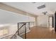 Loft area with wood floors and bright light with access to other rooms at 288 E Baylor Ln, Gilbert, AZ 85296