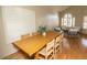 Sunny sitting area with a wood table, chairs, and ample window light at 288 E Baylor Ln, Gilbert, AZ 85296