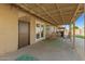Relaxing covered back patio with outdoor seating, perfect for entertaining at 3 S 130Th Pl, Chandler, AZ 85225