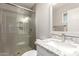 Updated bathroom with a glass-enclosed shower and granite vanity top at 3 S 130Th Pl, Chandler, AZ 85225