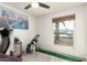 This bedroom is equipped with a ceiling fan, window and natural light at 3 S 130Th Pl, Chandler, AZ 85225